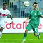 oussama zemraoui of al masry sc challenges ahmed abdelhamid of zamalek scaled e1770284488136 - OnzedAfrik